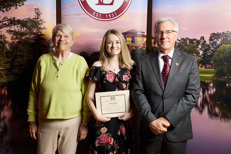 student with Dean Pratt and Program Director