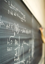 photo of hand at chalkboard