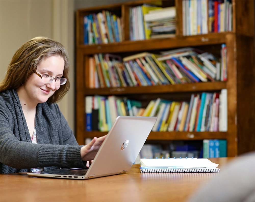 student working on a laptop