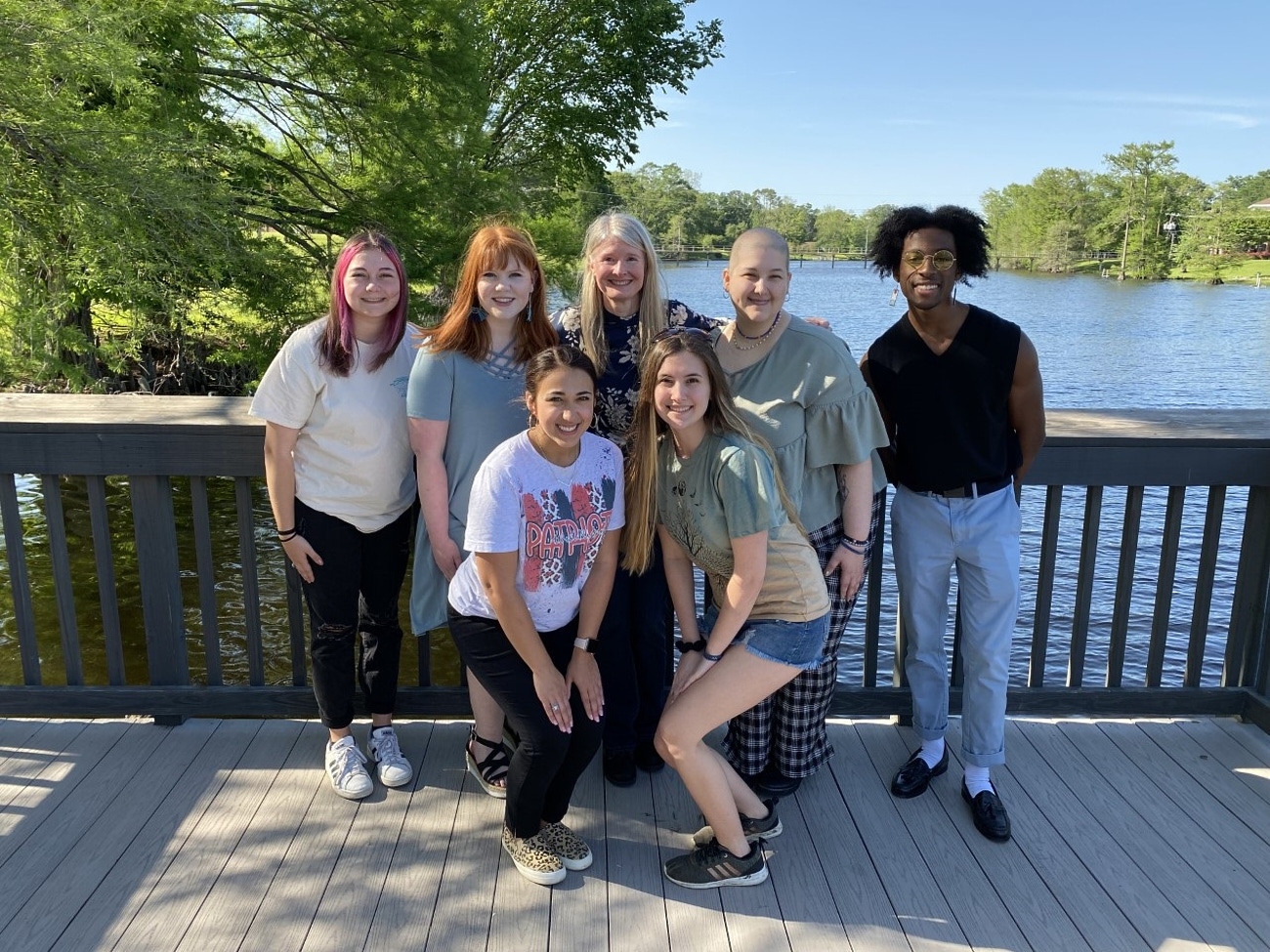 A group of ULM students pose in front of the bayou.