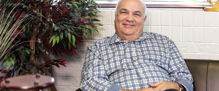 photo of Ashworth smiling in chair