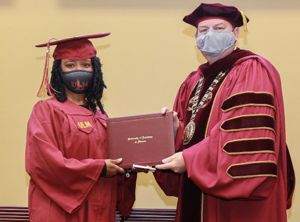 Berry and student at commencement