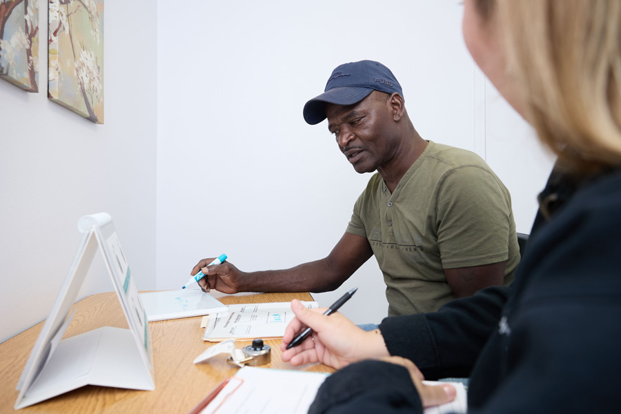 clinic staff working with adult client