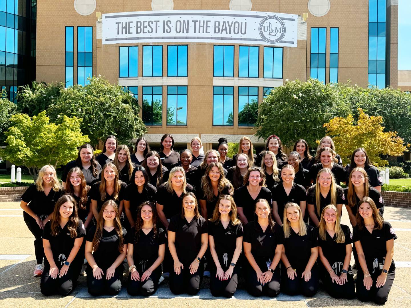 student group photo in library plaza